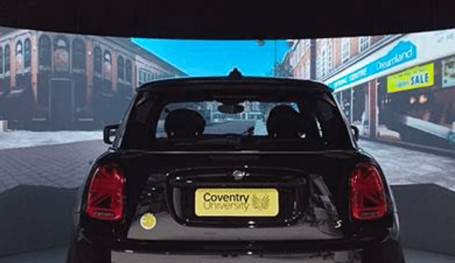 Coventry University driving simulation with Mini Cooper. Car model and screens pictured.