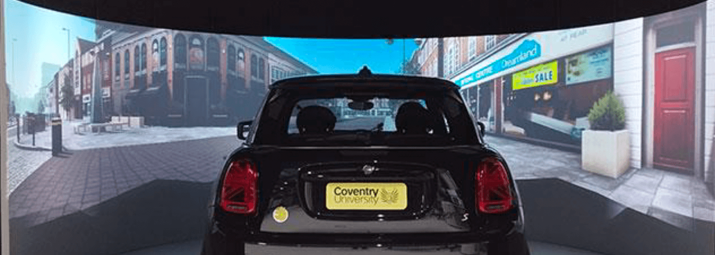 Coventry University driving simulation with Mini Cooper. Car model and screens pictured.