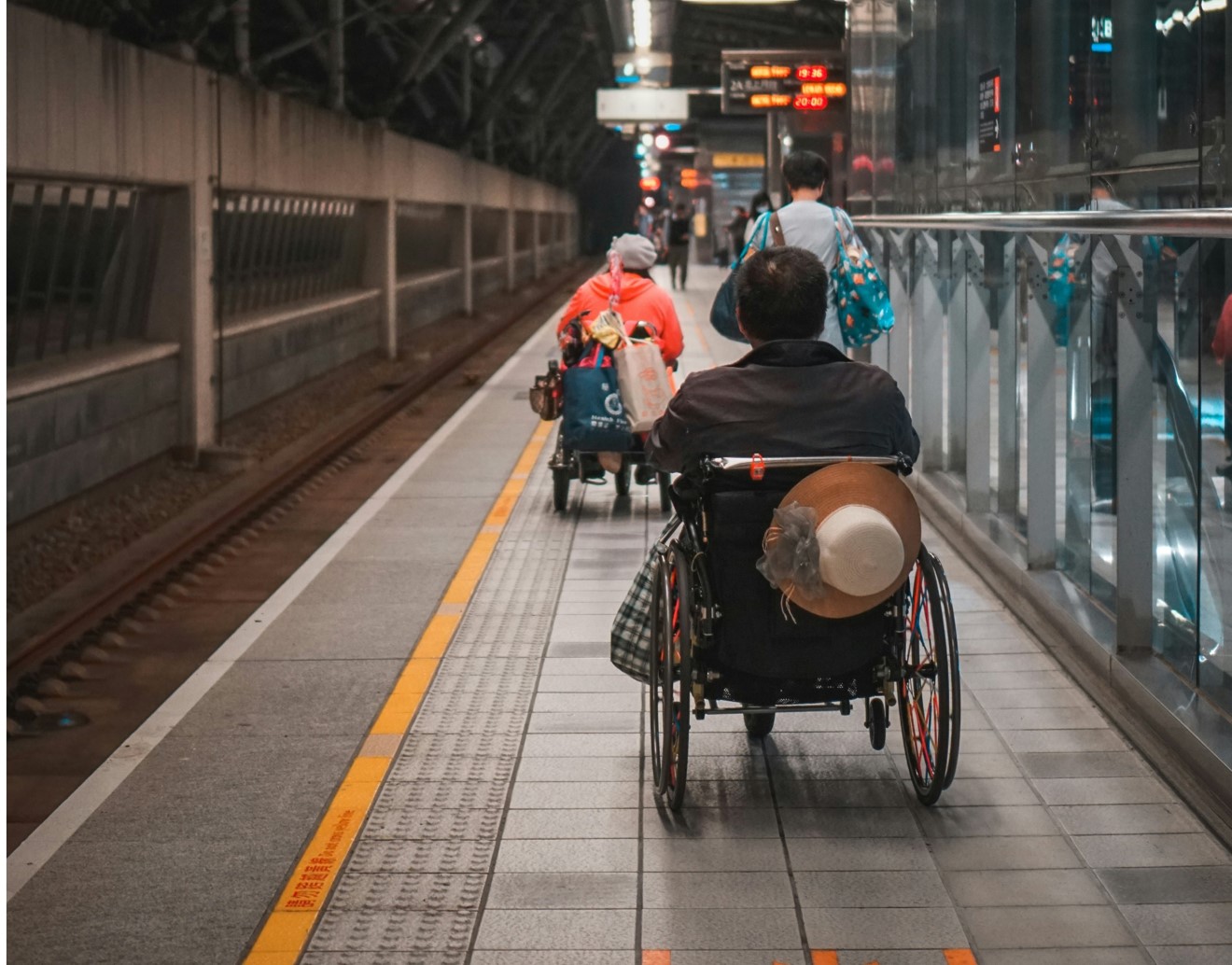 wheelchair users on train platform