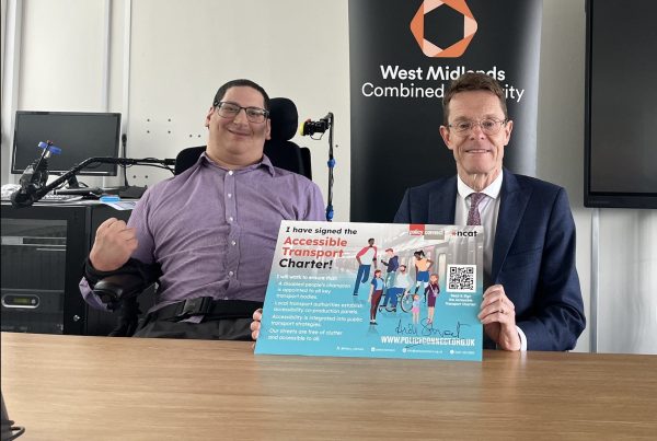 Clive Gilbert and Andy Street holding a copy of the Accessible Transport Charter